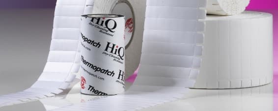 Rolls of Thermopatch HiQ tape and Hytex permanent label tape