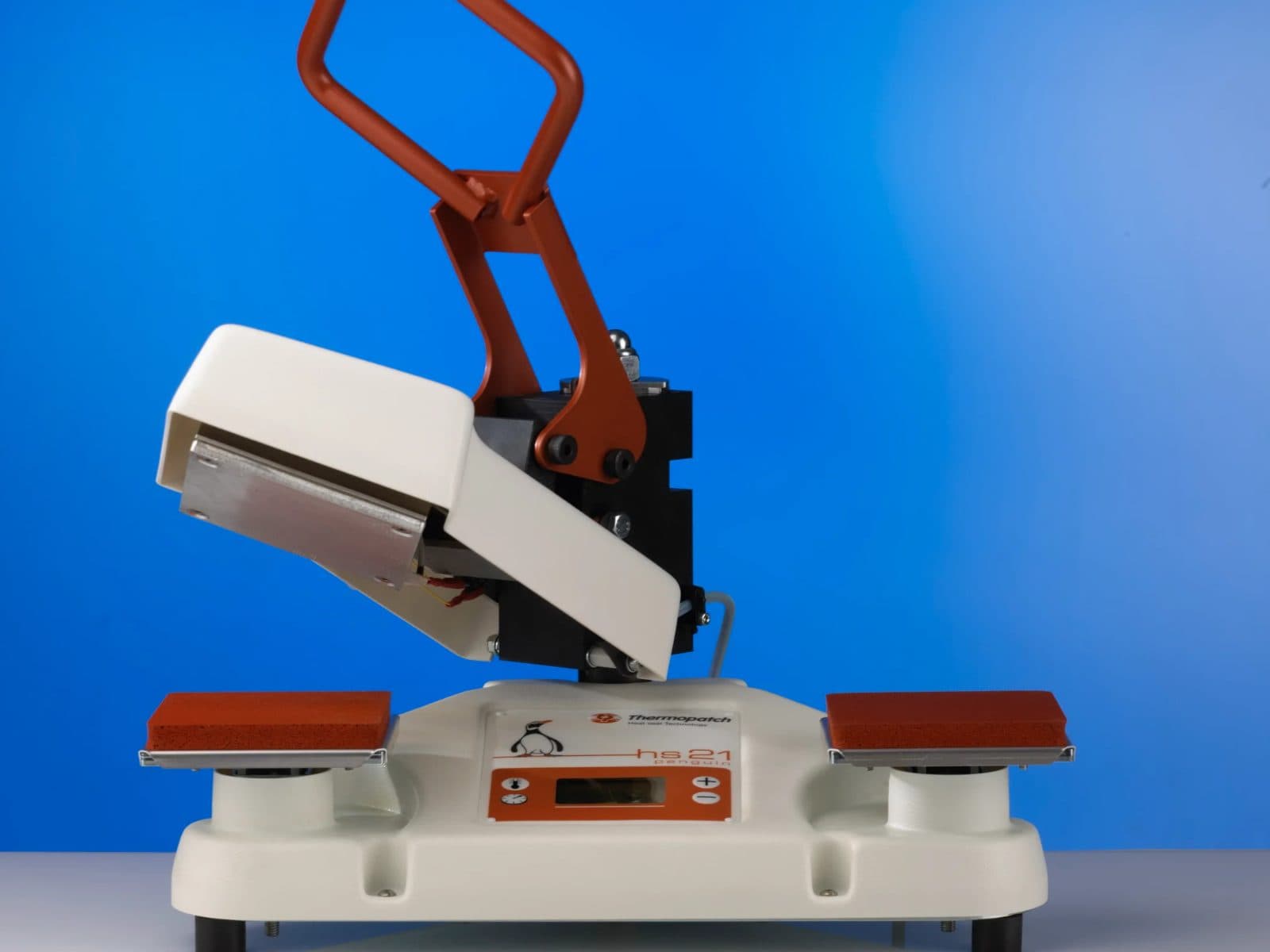 Thermopatch HS-21 SQR heat seal press, head raised over the left platen