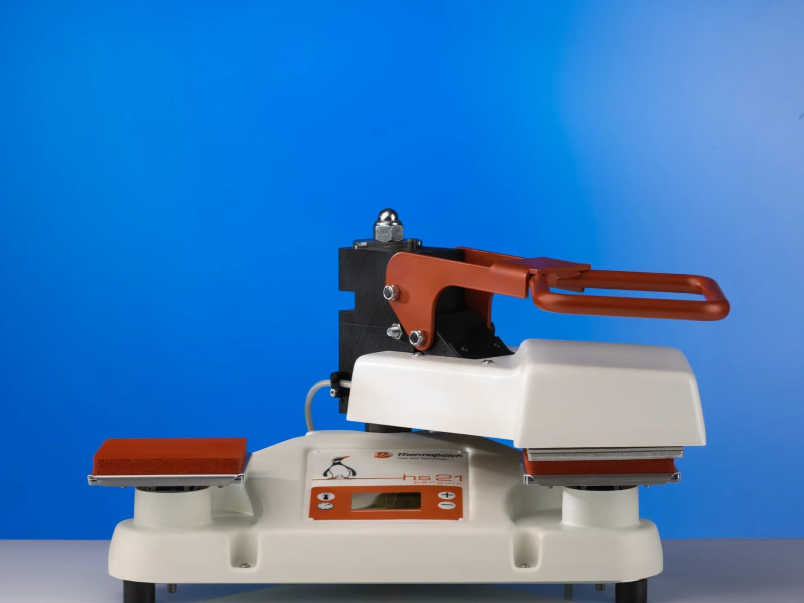 Thermopatch HS-21 SQR heat seal press, head lowered onto the right platen