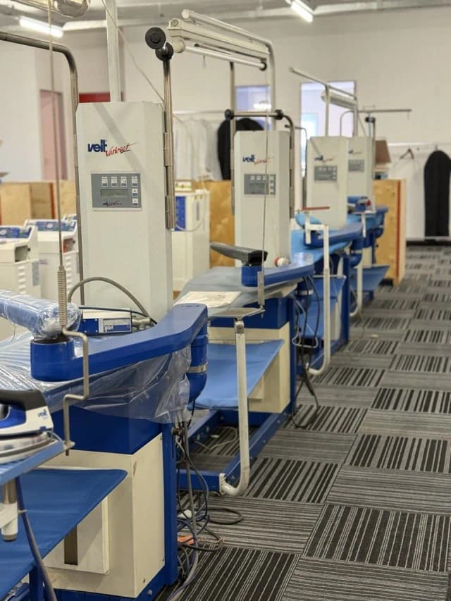 A row of VEIT finishing machines on the Unicorp showroom floor