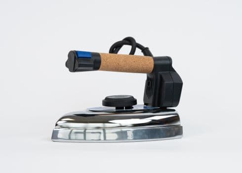 A Due Effe professional steam iron with a cork handle